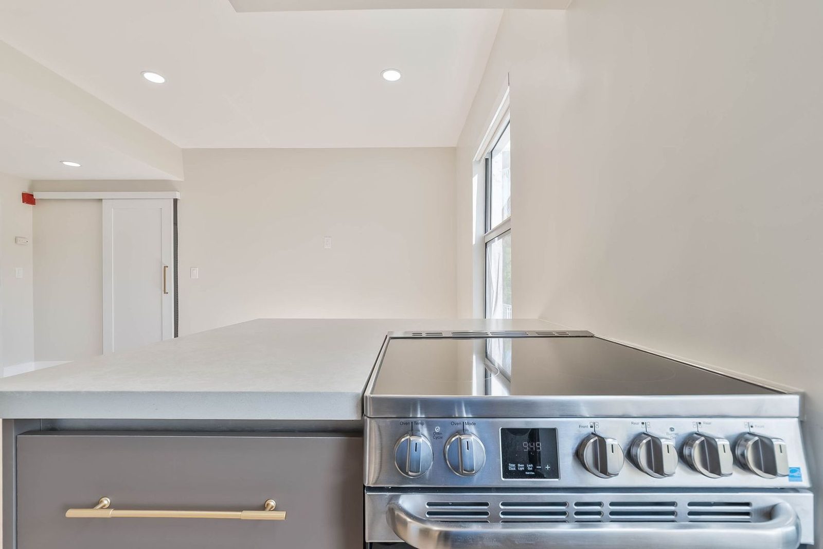 Remodeled kitchen with stainless range and vaulted ceiling