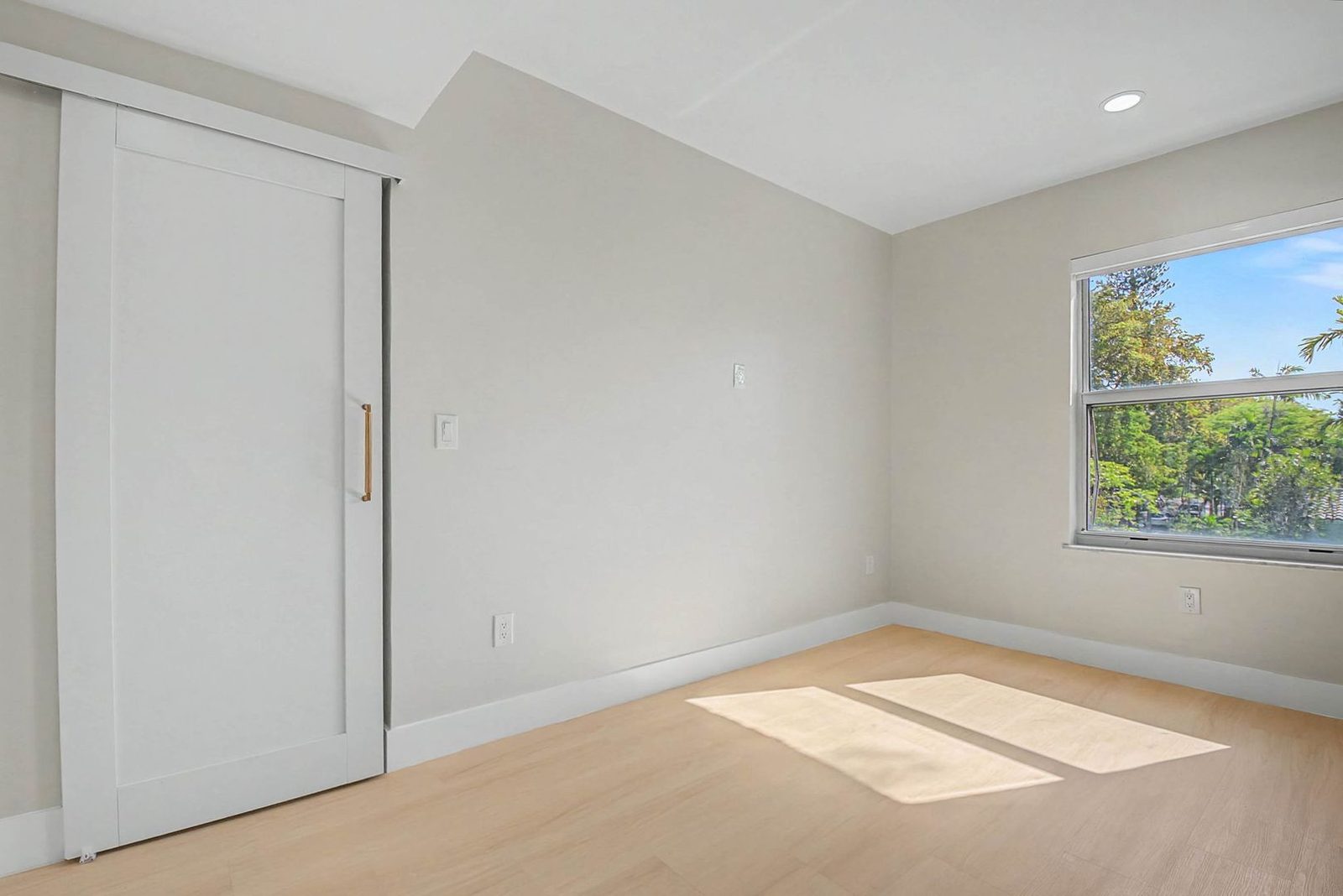 Bright bedroom with large window