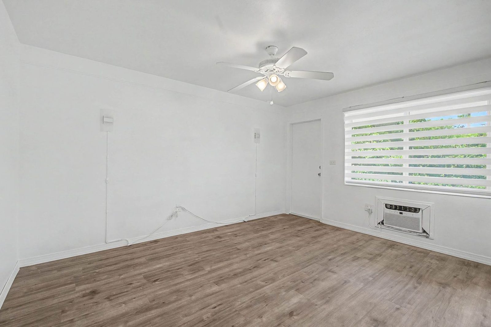 Living room with natural light and laminate wood floors